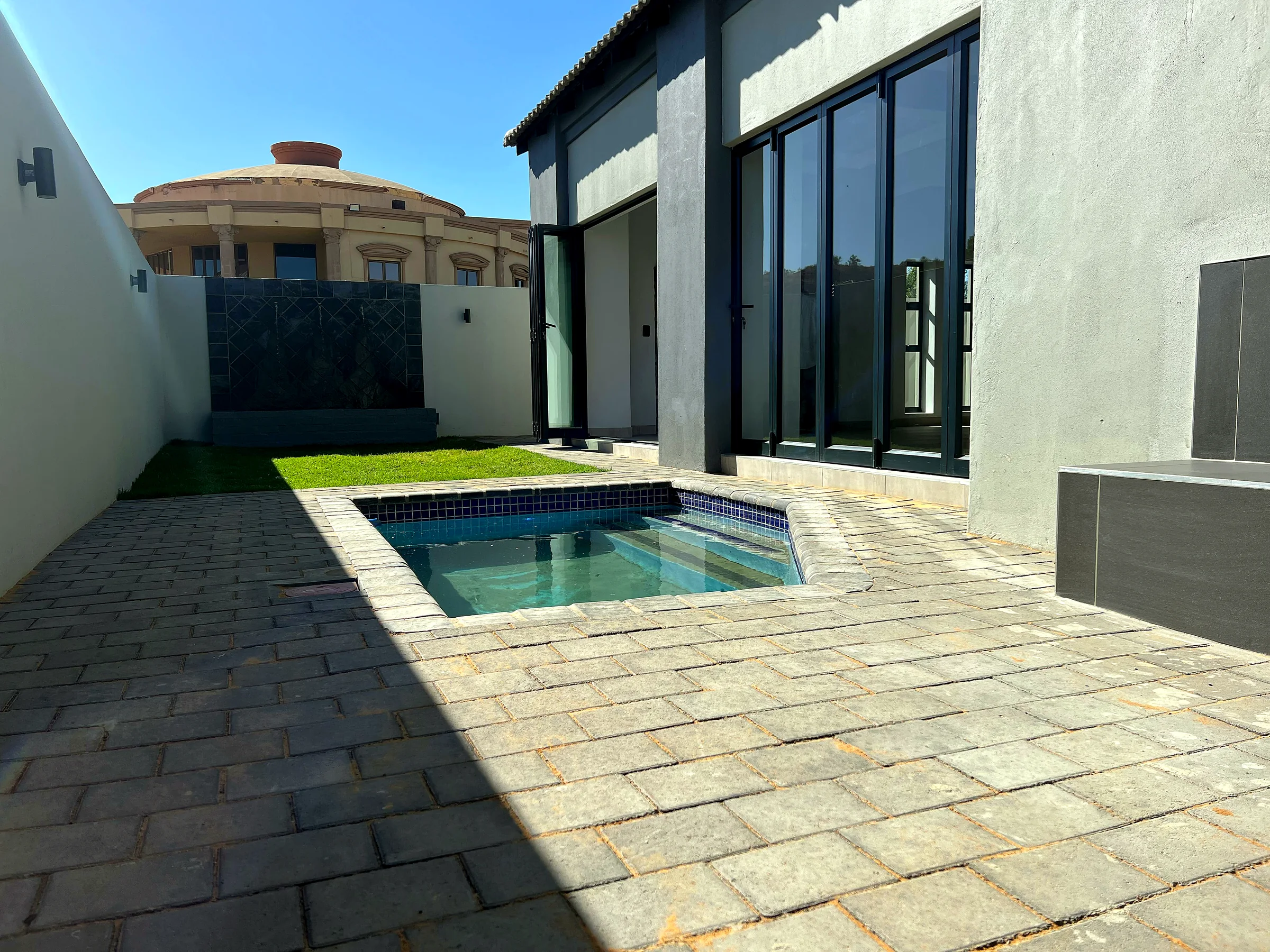 Refined family residence pool courtyard and outdoor entertainment area