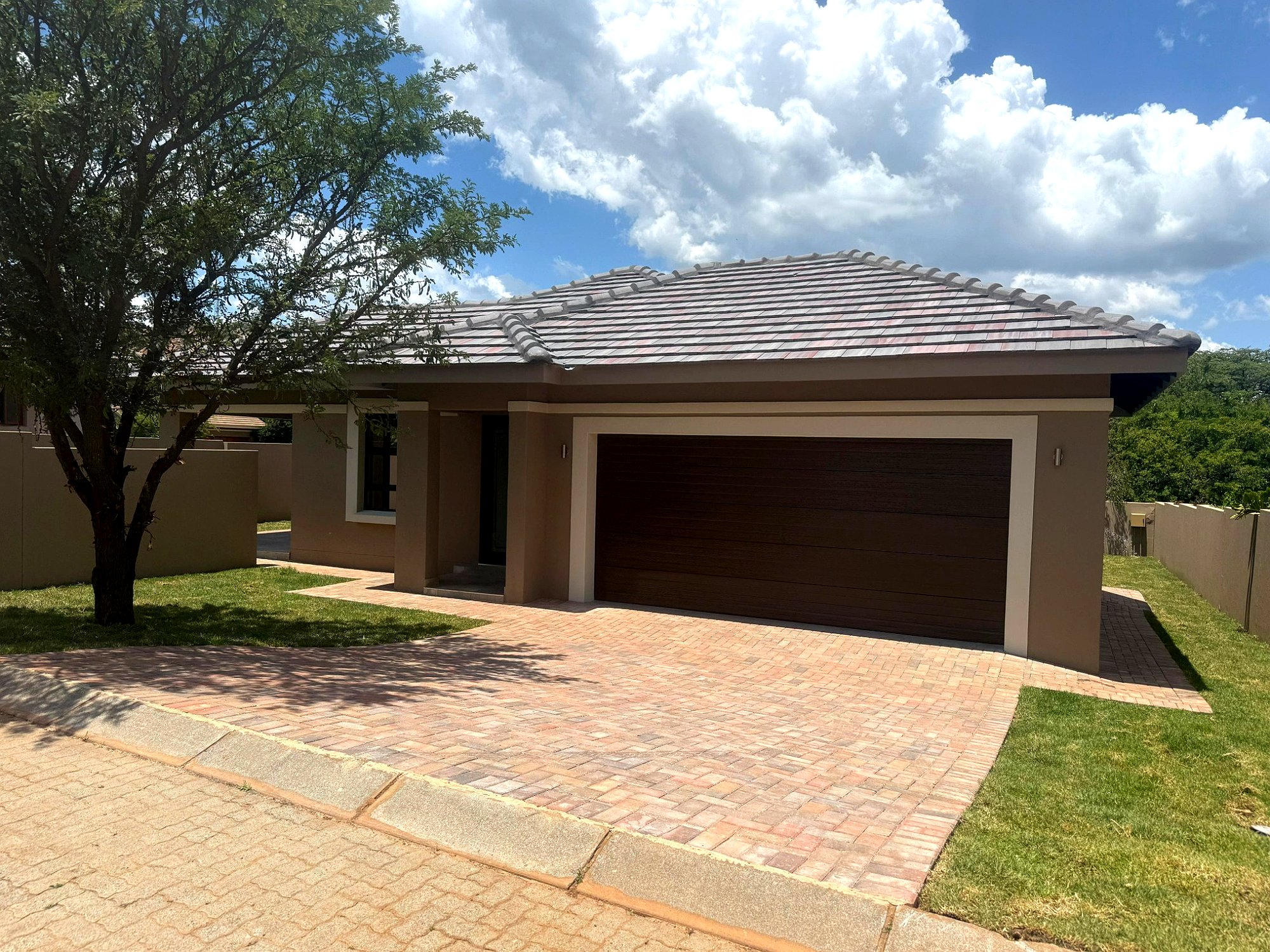 Completed front exterior of the contemporary courtyard home