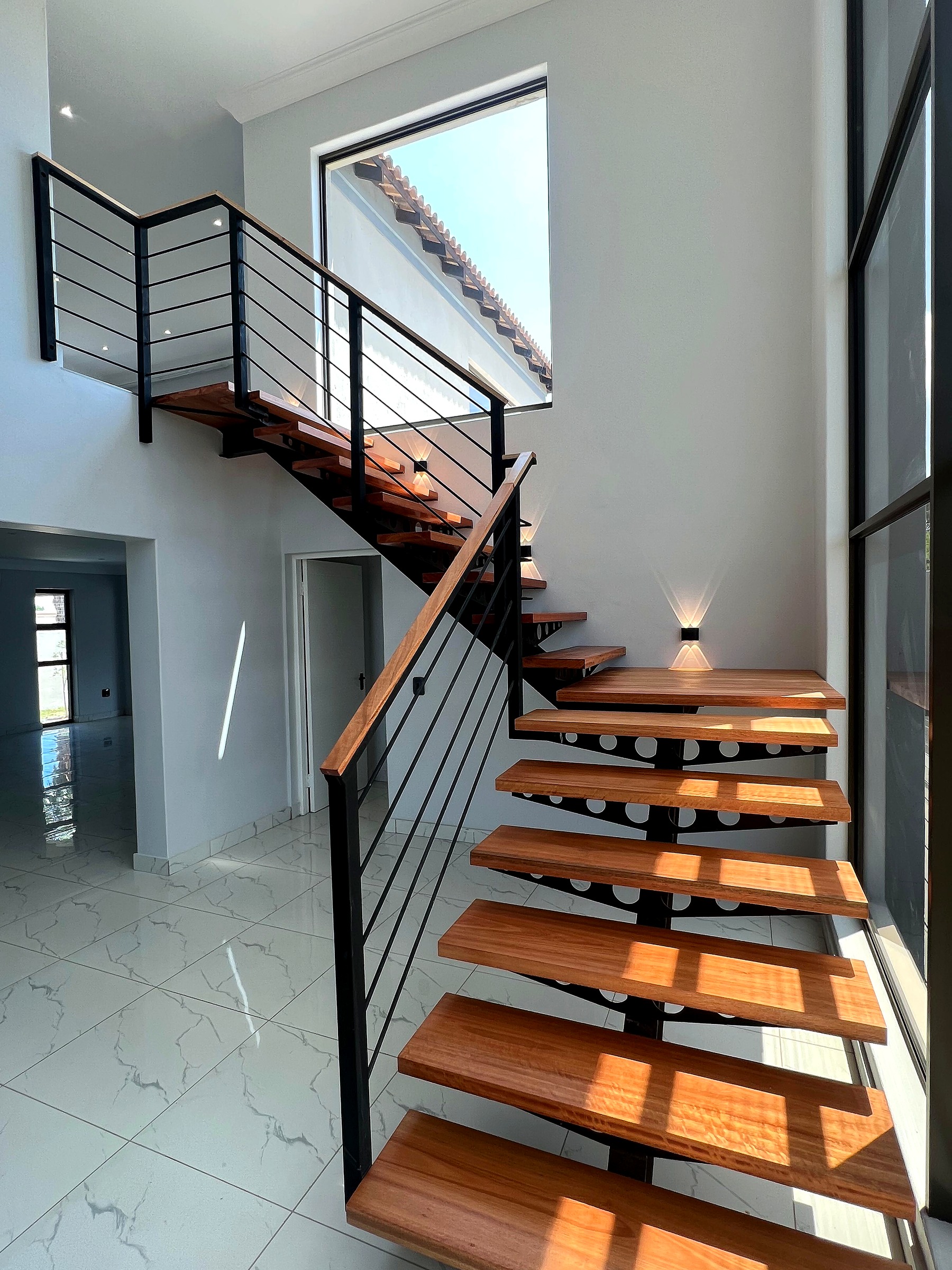 Finished feature staircase in the modern double-storey residence