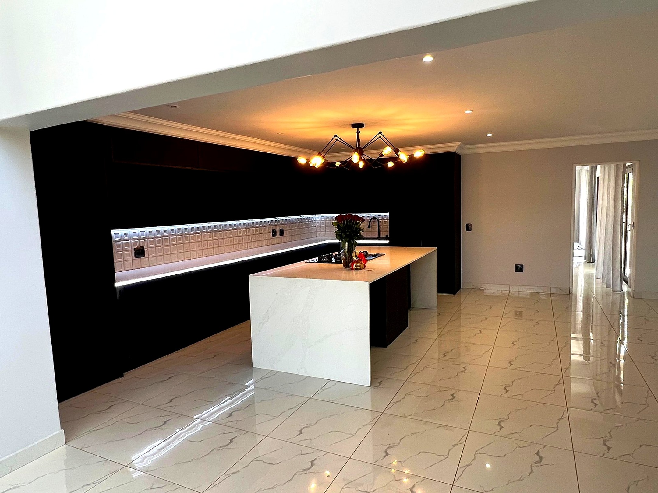 Wide open-plan interior view of the modern double-storey residence